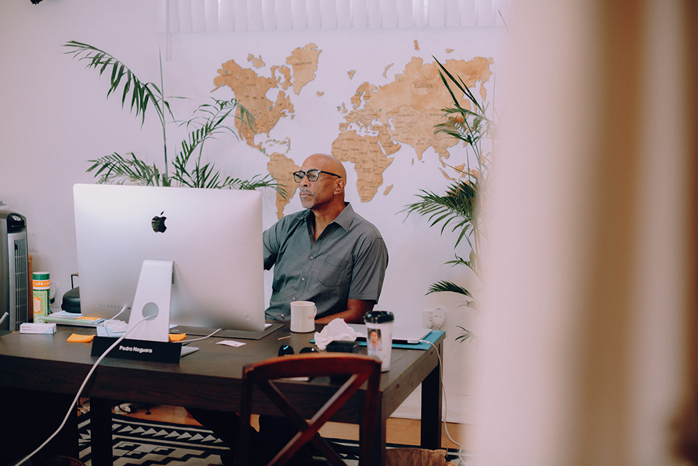 Noguera at work in his home office shortly after being appointed dean of USC Rossier. (Photo/Bethany Mollenkof)