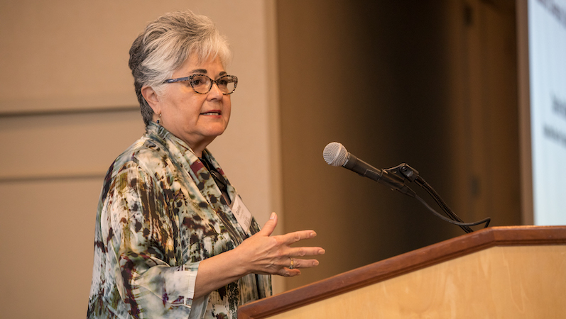 Darline Robles speaks to at podium during USC Rossier's annual fall kick-off event.