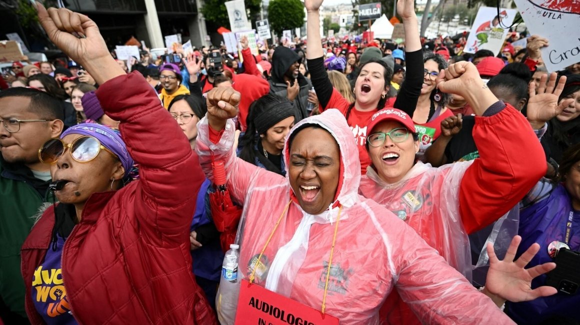 crowd of people striking