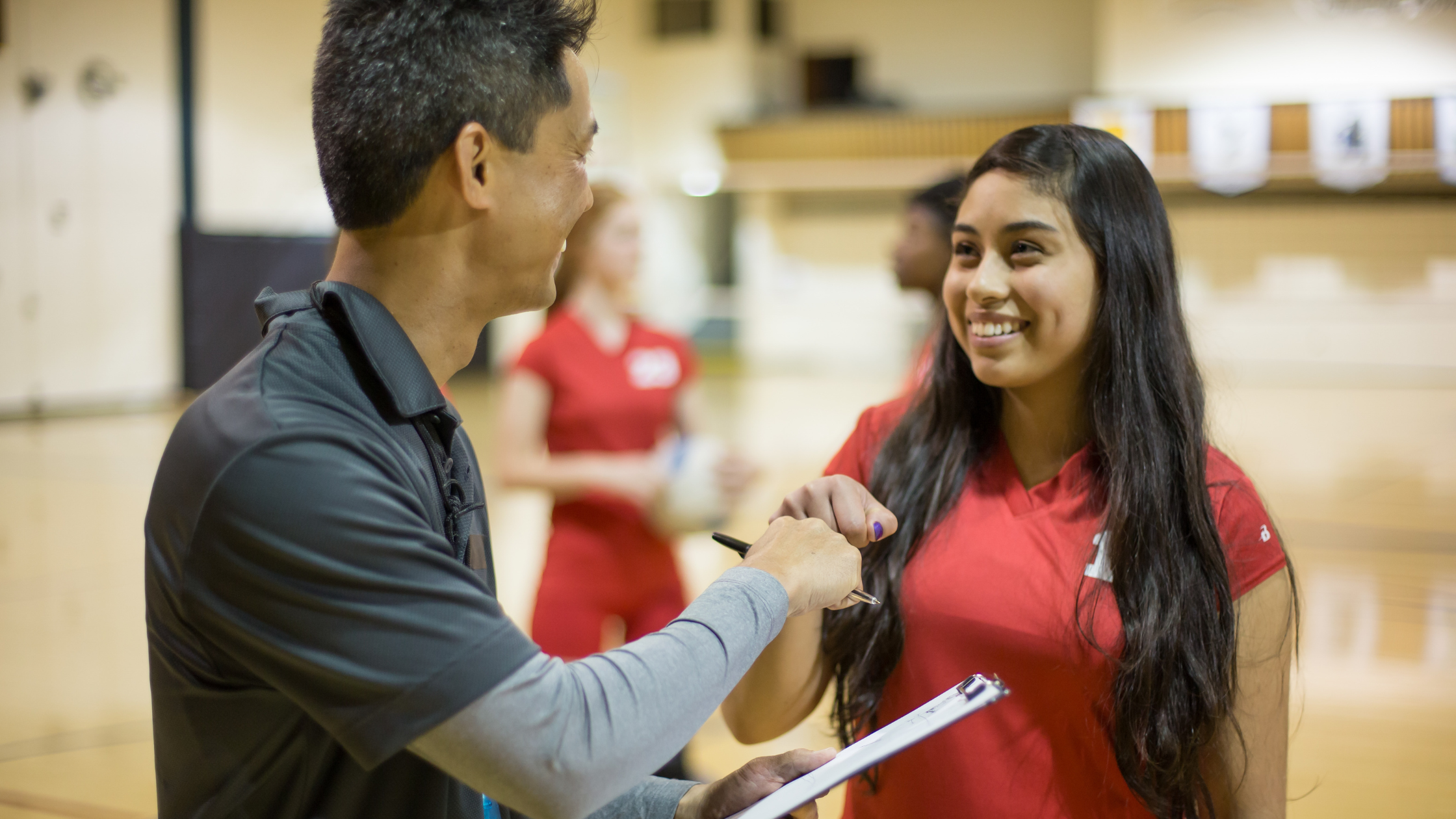 Sports Leader Fist Bumping Athlete