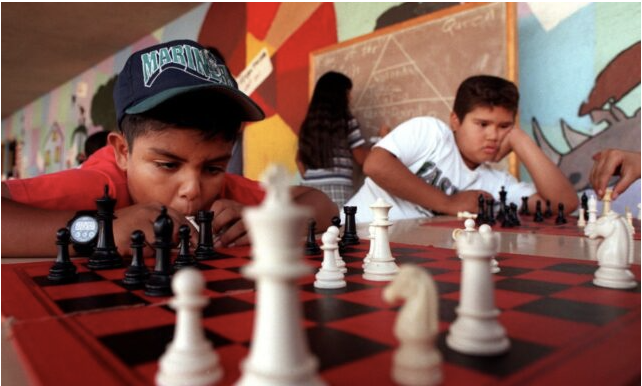 kids playing chess game