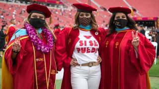Doctoral graduates Mercy Willard EdD ’21, Maria-Romero Morales EdD ’21 and Isabel Brenes EdD ’21, from left, at USC Rossier’s 2021 Commencement. (USC Photo/Michael Baker)