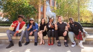The inaugural class of USC Rossier’s new Teacher Preparation Residency program in front of the Traveler statue at USC’s University Park Campus. Back row, left to right: Elijah Chesley BA ’21 and Joseph Arechiga; front row, left to right: Ramiro Alexander-Duchesne BA ’ 17, Jamie Roman Nunez, Lauryn Merriweather and Derringer Dillingham