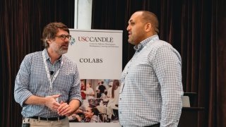 Two attendees speak at USC CANDLE COLAB event.