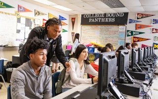 Teacher with students at the Center for Enrollment Research, Policy and Practice (CERPP)