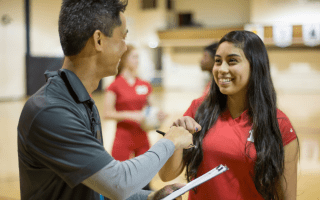 Sports Leader Fist Bumping Athlete