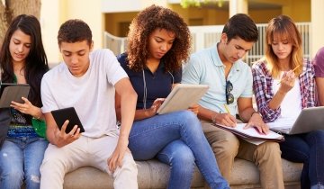 Students sitting outside studying