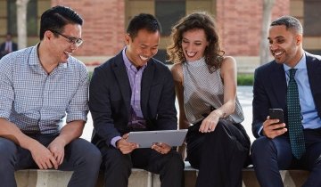 Professional group discussing paperwork