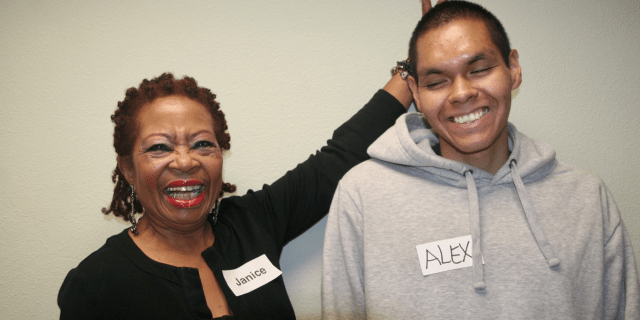 Photo of an adult Black woman and young Black teen.