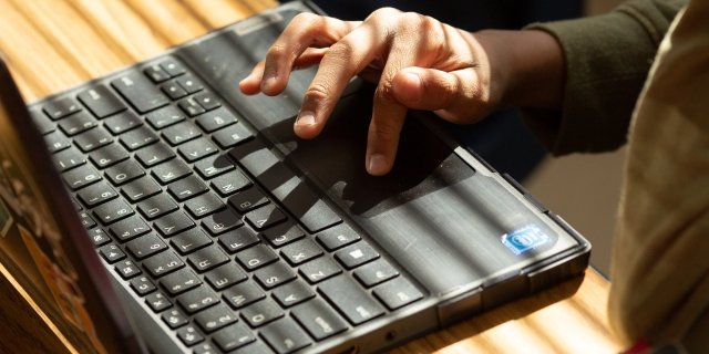 AMERICANED_SUTTON_065 (1).jpg Student typing on a laptop.