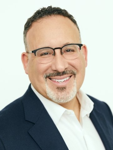 Official portrait of US Education Secretary Miguel Cardona who was interviewed by USC Rossier Dean Pedro Noguera about the American Rescue Plan