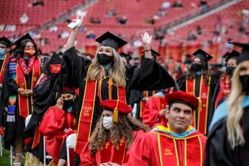 Graduates celebrate during USC’s Commencement Ceremony for the Rossier School of Education at the Los Angeles Memorial Coliseum. (USC Photo/David Sprague)