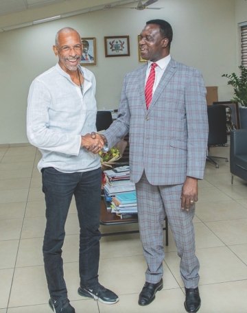 Dean Noguera shakes hands with Yaw Osei Adutwum