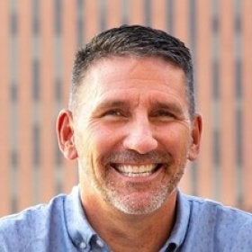 Headshot portrait of Marc Pritchard smiling outdoors