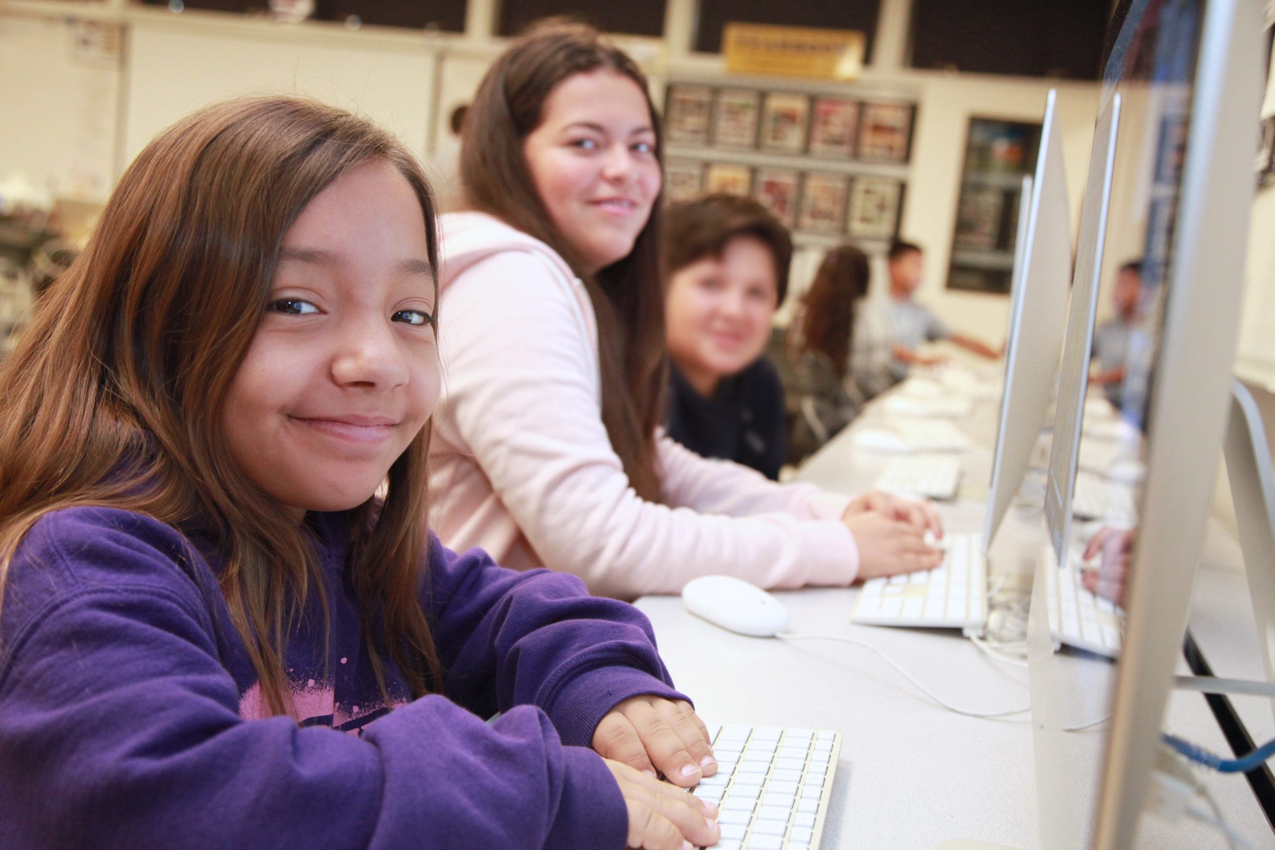 Two students smiling together during an education technology program