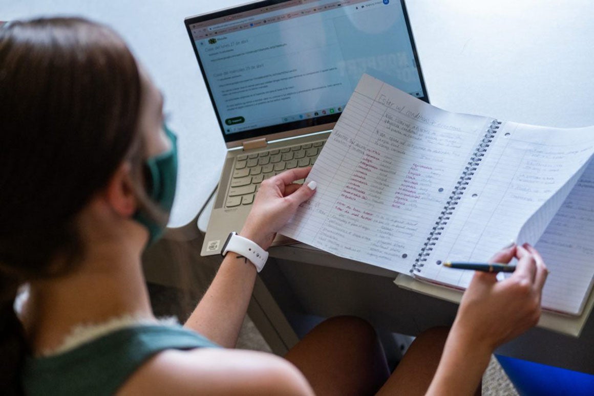 Researcher reviewing documents related to a COVID-19 study