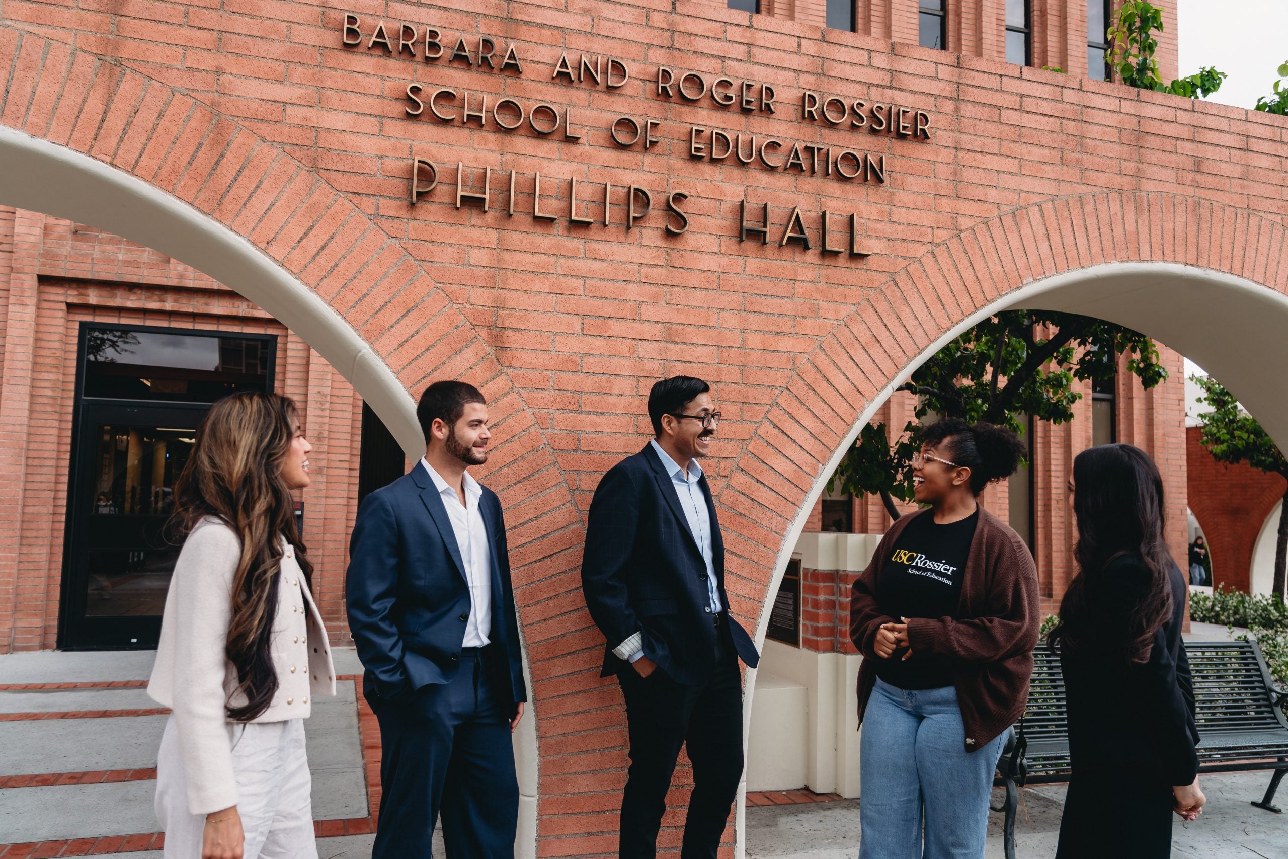 Students standing outside of the USC Rossier building